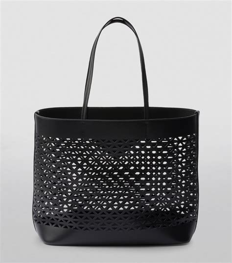 prada perforated bag|Prada Large perforated leather tote bag .